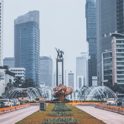 park with fountain near buildings