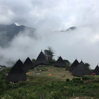 black Nipa huts during daytime